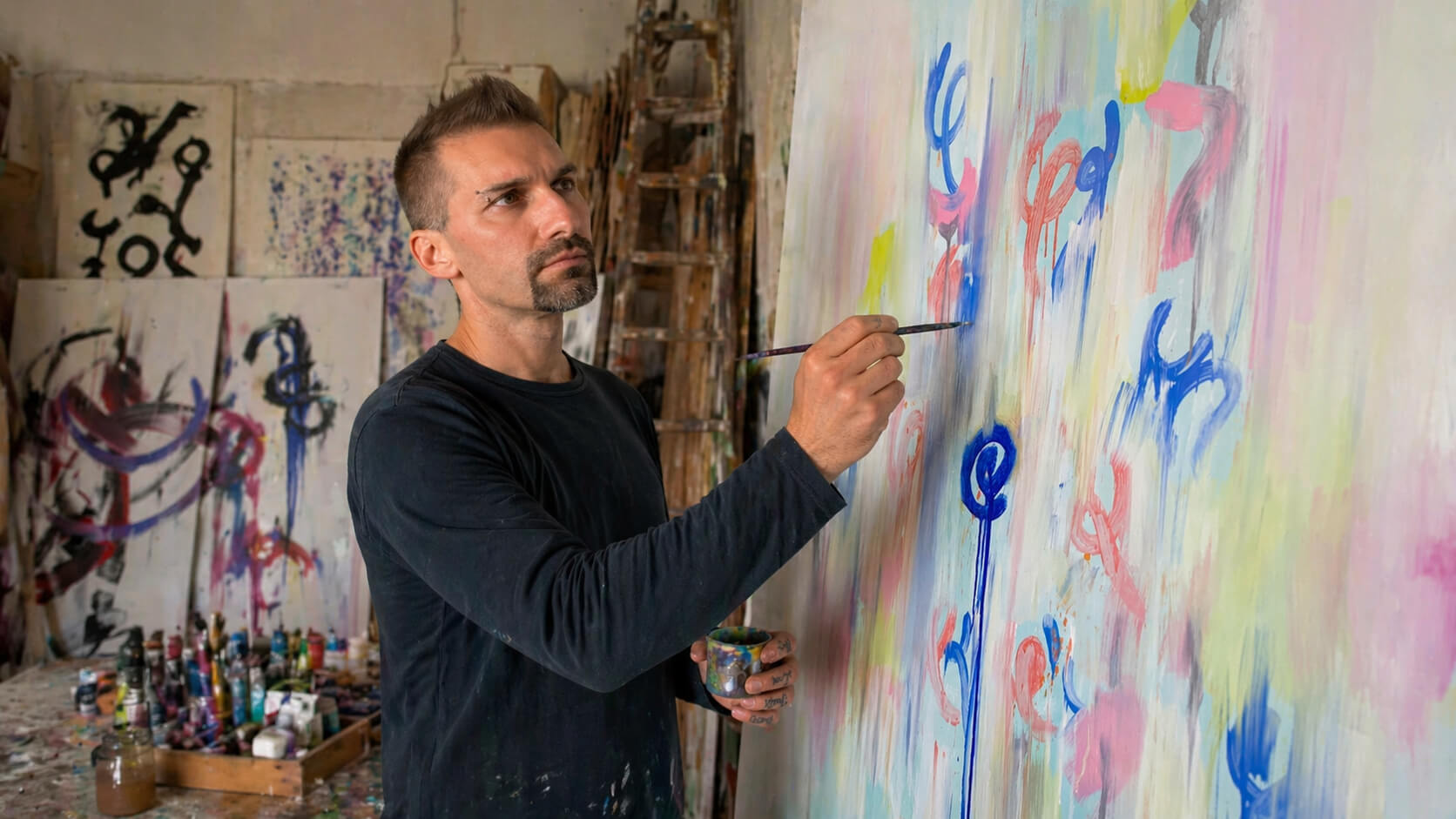 Emanuele Fortunati painting in his studio